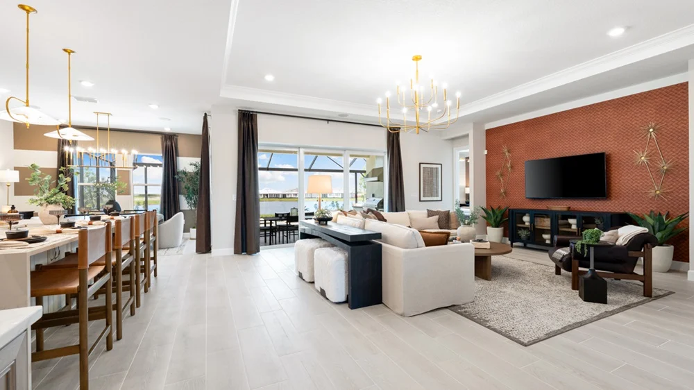 Open great room and kitchen in the Lavello, with sliding doors opening to the lanai